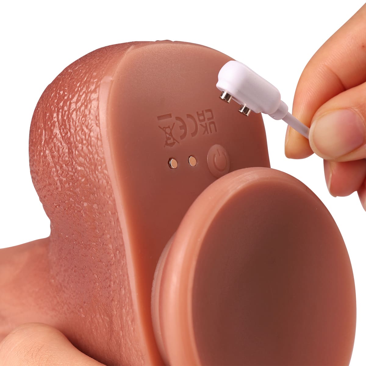 Thrusting dildo with convenient magnetic charging